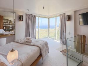 Ένα ή περισσότερα κρεβάτια σε δωμάτιο στο Vibhu Estate 10 Bedrooms and Suites +37 φωτογραφίες
