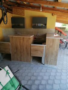 a bathroom with two sinks and two mirrors at Dedovina in Soko Banja +33 photos