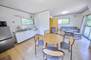 a kitchen and dining room with a table and chairs at WATERSIDE Base 鹿嶋 北浦 in Kashima
