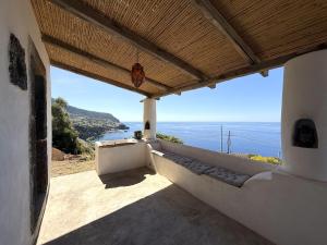 a balcony with a view of the ocean at Casa Chiara, terrace with sea view in Malfa