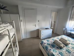 A bed or beds in a room at Il Giardino di Anna - Charming rooms in Cagliari