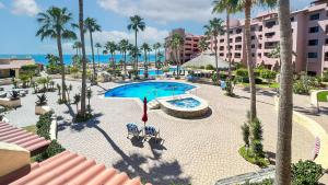 an aerial view of a resort with a pool and palm trees at Marina Pinacate 105 A License To Chill Pool-Side in Puerto Peñasco