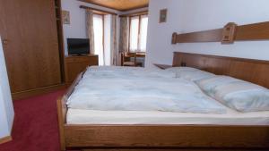 מיטה או מיטות בחדר ב-Monte Rosa