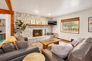 a living room with a couch and a fireplace at Sugar Bear Pines #2493 in Sugarloaf
