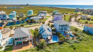 an aerial view of a resort with the ocean at Aqua Dreams - Pet Friendly! Heated Private Pool! in Padre Island