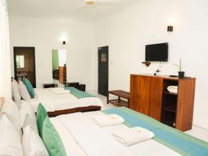 Letto o letti in una camera di The Panorama Negombo