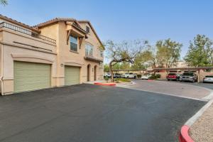 a parking lot in front of a house at Mountain View #912 Surprise in Surprise