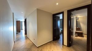 a hallway with two open doors to a room at Grand Ocean Sokhna Hotel & Resort in Ain Sokhna +95 photos