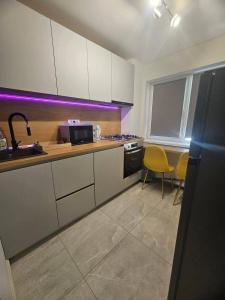 Kuchyň nebo kuchyňský kout v ubytování Modern & Glam Studio Costi