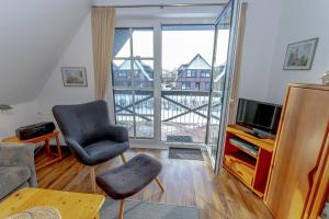 Televisyen dan/atau pusat hiburan di Ferienwohnung Seebär