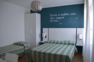 Voodi või voodid majutusasutuse Hotel Sette Note toas