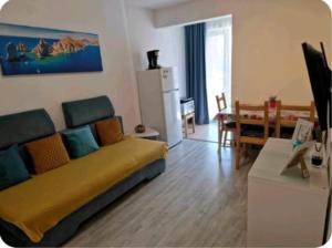 a living room with a couch and a table at Saturn Alfa Residence - 2 Rooms Apartment in Saturn