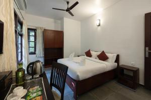 Ein Bett oder Betten in einem Zimmer der Unterkunft Avadale Munnar (Stag Groups Not Allowed)