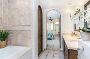 a bathroom with two sinks and a large mirror at Bella Sirena in La Choya +10 photos