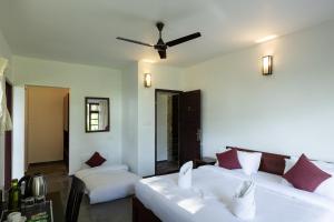 Ein Bett oder Betten in einem Zimmer der Unterkunft Avadale Munnar (Stag Groups Not Allowed)