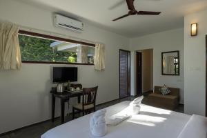 Ein Bett oder Betten in einem Zimmer der Unterkunft Avadale Munnar (Stag Groups Not Allowed)