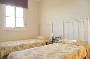 Ένα ή περισσότερα κρεβάτια σε δωμάτιο στο Terrasol Baviera Golf +14 φωτογραφίες