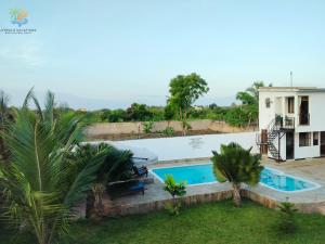 an image of a swimming pool in a villa at 1 bedroom suite Diani in Ukunda Airport