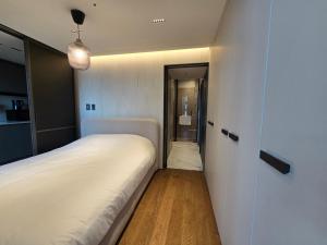Letto o letti in una camera di Samsung Coex House