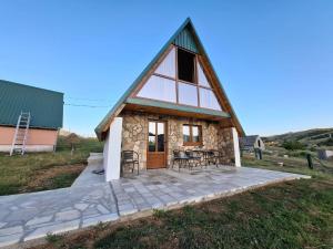 a small house with a thatched roof at Village house Gutovic in Rudinice +37 photos