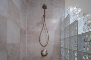 a shower with a shower head in a bathroom at Sonoran Sea in Campo del Medio +26 photos