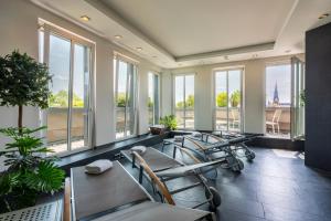 a waiting room with chairs and windows in a building at Hotel NEWBERLIN in Berlin
