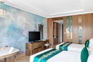 Postel nebo postele na pokoji v ubytování hotel julee