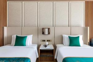 Postel nebo postele na pokoji v ubytování hotel julee