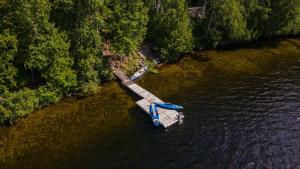 an aerial view of a boat in the water at Lake and Pool Table - Au Pied du Lac in Labelle