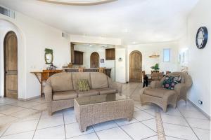 a living room with a couch and chairs and a table at Bella Sirena in La Choya