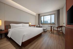Katil atau katil-katil dalam bilik di Maison New Century Tongxiang