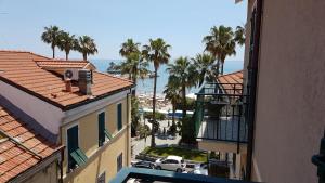 an aerial view of a city with palm trees and the ocean at BnB Cairoli - Homezon in Diano Marina