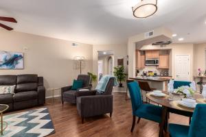 a living room and dining room with a table and chairs at Mountain View #912 Surprise in Surprise