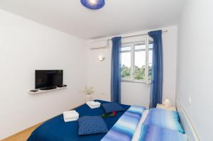 Posteľ alebo postele v izbe v ubytovaní Apartments Pavle
