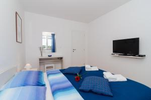 Posteľ alebo postele v izbe v ubytovaní Apartments Pavle