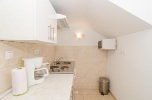 Kuchyňa alebo kuchynka v ubytovaní Apartments Pavle + 37 fotografií