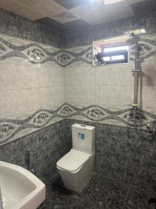 a bathroom with a white toilet and a sink at Ag ev in Mekhrably +21 photos