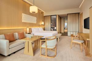 Istumisnurk majutusasutuses Secan Hotel Qingdao, Curio Collection By Hilton