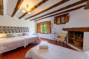 Ένα ή περισσότερα κρεβάτια σε δωμάτιο στο Casa Rural Molino Del Machero