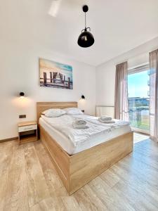 Ένα ή περισσότερα κρεβάτια σε δωμάτιο στο Apartamenty 5 mórz +131 φωτογραφίες