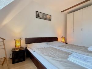 Voodi või voodid majutusasutuse Ferienwohnung Doberauer - gemütliche Ferienwohnung im Herzen Lindaus toas