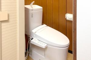 a bathroom with a white toilet in a room at 南知多山海ビーチフロント左衛門亭 in Minamichita +42 photos