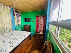 Postel nebo postele na pokoji v ubytování ANURAG HOMESTAY