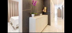 a room with a white cabinet with flowers on it at Azure Bliss in Costa de Adeje +11 photos