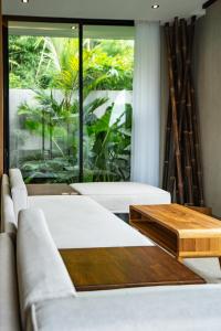 Katil atau katil-katil dalam bilik di Titi House Villa 2 by Betterplace