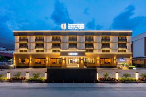 a hotel front of a building at night at Rama9 No1 Hotel in Bangkok