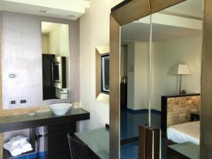 Postel nebo postele na pokoji v ubytování Hotel La Lucertola