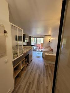 a view of a living room and kitchen of a house at Studio Bord de Mer Résidence - Les Sablettes in La Seyne-sur-Mer