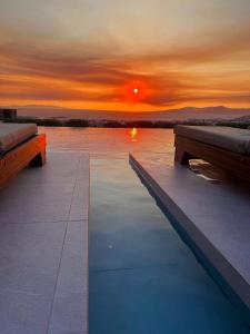 The sunrise or sunset as seen from a panziókat or nearby