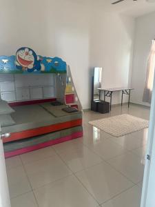 Postel nebo postele na pokoji v ubytování D'rose Homestay Kluang